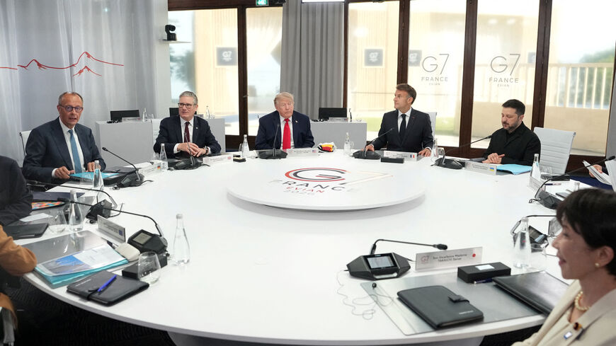 FILE PHOTO: German Chancellor Friedrich Merz, British Prime Minister Keir Starmer, U.S. President Donald Trump, French President Emmanuel Macron, Ukrainian President Volodymyr Zelenskyy and Japan’s Prime Minister Sanae Takaichi during a working session at the G7 summit in Evian-les-Bains, France, June 16, 2026. Thibault Camus/Pool via REUTERS/File Photo