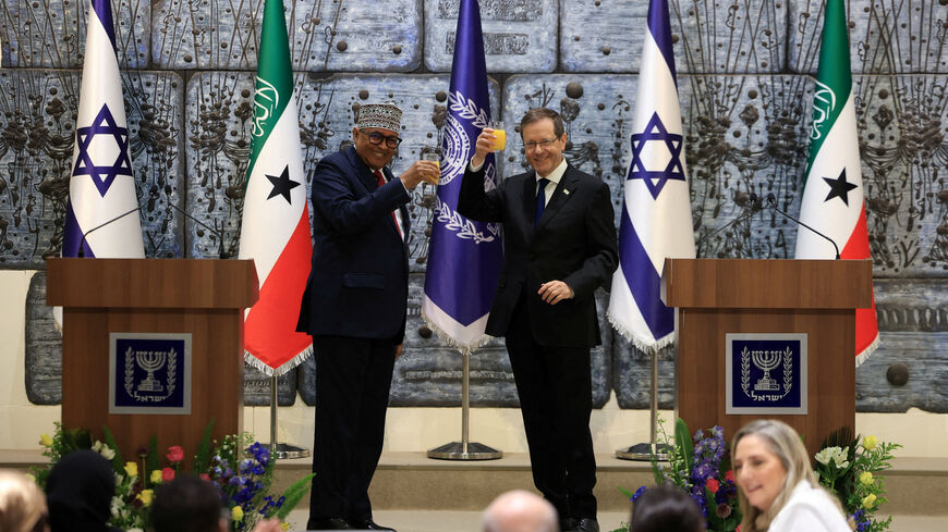 FILE PHOTO: Israel's President Isaac Herzog and Somaliland's President Abdirahman Mohamed Abdullahi hold up glasses of beverage before giving statements to the press at the President's Residence in Jerusalem, June 14, 2026. REUTERS/Ronen Zvulun/File Photo