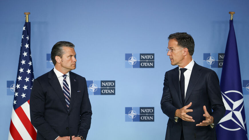 U.S. Defense Secretary Pete Hegseth and NATO Secretary General Mark Rutte talk to the media on the day of a meeting of NATO defence ministers at the alliance's headquarters in Brussels, Belgium, June 18, 2026. REUTERS/Stoyan Nenov