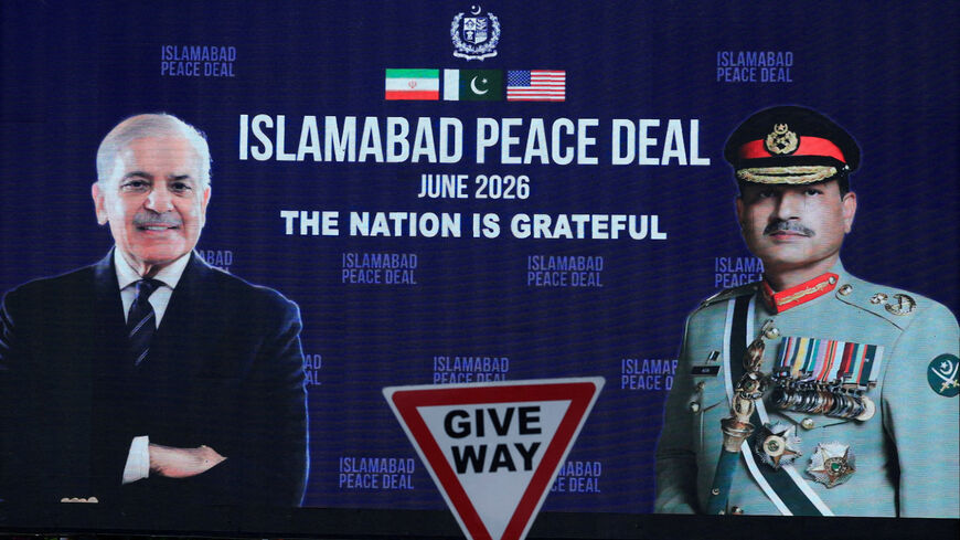 FILE PHOTO: A roadside billboard displaying portraits of Pakistan's Chief of Army Staff Field Marshal Asim Munir and Prime Minister Shehbaz Sharif, following a deal between the U.S. and Iran, in Islamabad, Pakistan, June 16, 2026. REUTERS/Akhtar Soomro/File Photo