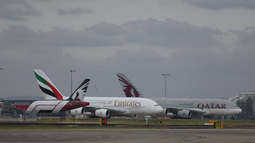 Emirates and Qatar Airways planes on the tarmac at Sydney Kingsford Smith Airport in Sydney, Australia, March 3, 2026. REUTERS/Hollie Adams