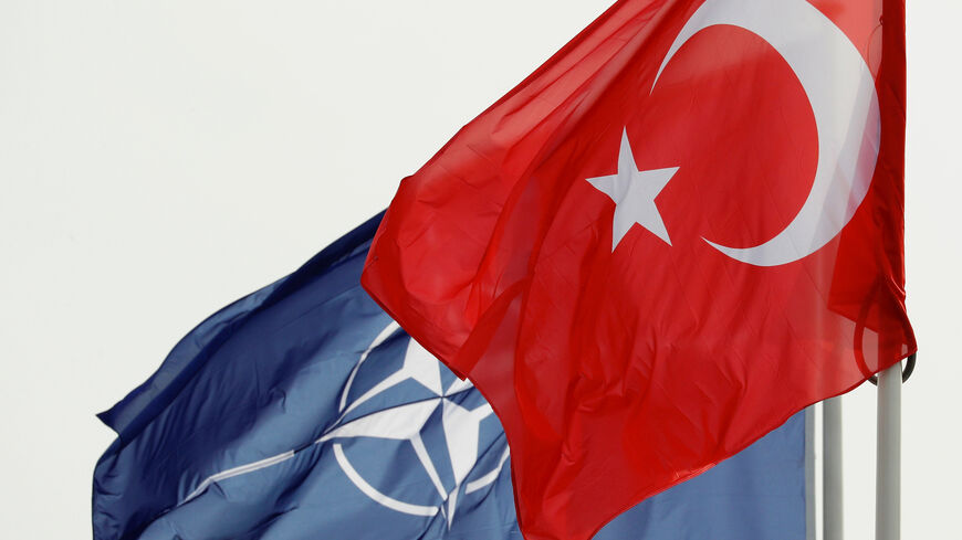 NATO and Turkish flags flutter at the Alliance headquarters in Brussels, Belgium, February 28, 2020.  REUTERS/Francois Lenoir