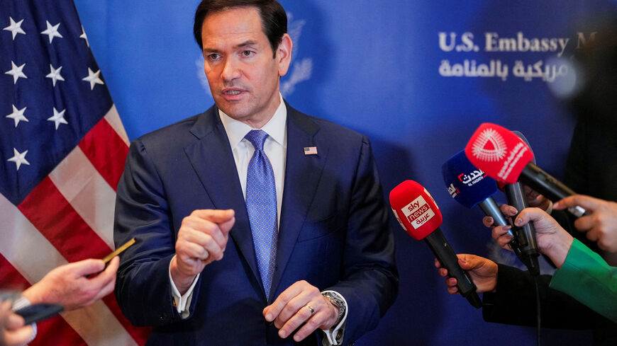 FILE PHOTO: U.S. Secretary of State Marco Rubio speaks with members of the media before departing for Bahrain International Airport after his visit to the Middle East to discuss the interim deal between the U.S. and Iran with Arab Gulf allies, in Manama, Bahrain, June 25, 2026. REUTERS/Eric Lee/Pool/File Photo
