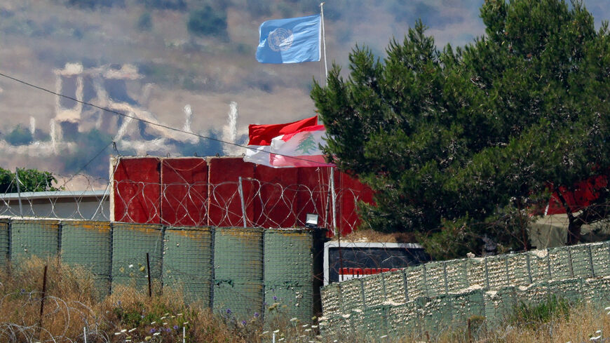Flags, including a Lebanese flag and a United Nations (UN) flag, fly at a UN post in Lebanon, after Israel and Lebanon signed a framework agreement following U.S.-mediated talks, as seen from northern Israel, June 27, 2026. REUTERS/Amir Cohen