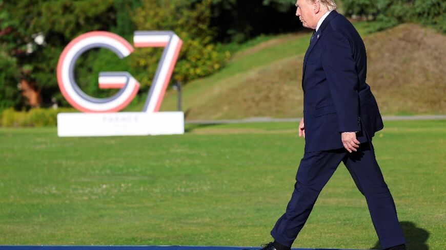 US President Donald Trump arrives for the official greeting during the G7 summit, in Evian, eastern France