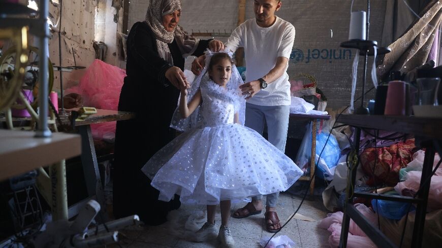 A Gaza tailor is making dresses for children and women from used fabrics, giving them a new look 