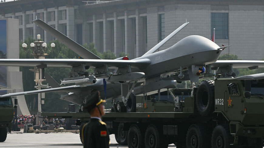 An unmanned aerial vehicle is seen during a military parade marking the 80th anniversary of victory over Japan and the end of World War II, in Beijing's Tiananmen Square on September 3, 2025. (Photo by GREG BAKER / AFP) (Photo by GREG BAKER/AFP via Getty Images)