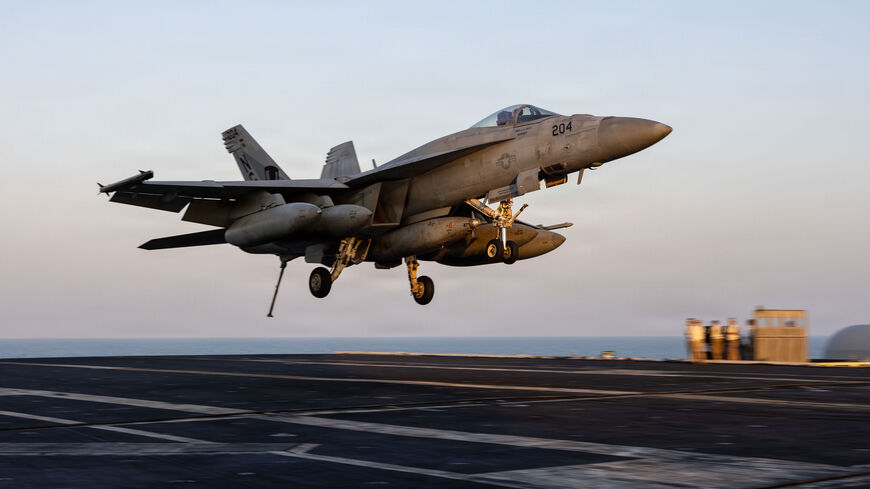  In this US Navy released handout, an F/A-18E Super Hornet, attached to Strike Fighter Squadron (VFA) 14, prepares to make an arrested landing on the flight deck of Nimitz-class aircraft carrier USS Abraham Lincoln (CVN 72) in support of Operation Epic Fury on March 1, 2026 at Sea. 