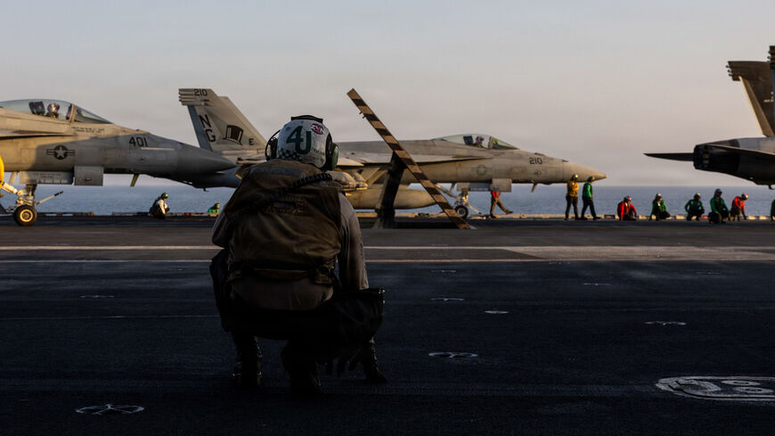 In this US Navy released handout, an F/A-18E Super Hornet, attached to Strike Fighter Squadron (VFA) 14, prepares to take off from the flight deck of Nimitz-class aircraft carrier USS Abraham Lincoln (CVN 72) in support of Operation Epic Fury on March 1, 2026 at Sea. 