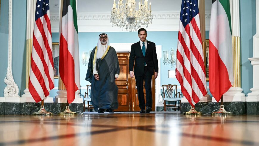 US Secretary of State Marco Rubio and Kuwaiti Foreign Minister Sheikh Jarrah Jaber Al-Ahmad Al-Sabah walk together during a brief appearance for the press as they meet at the State Department in Washington, DC, on June 4, 2026. 