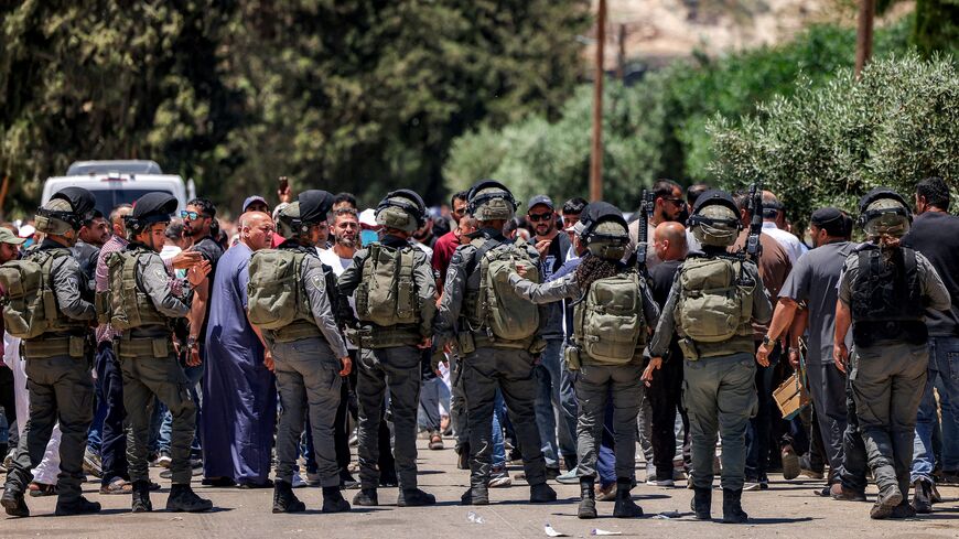 Israeli security forces attempt to disperse Palestinians who had gathered to protest the reported burning of land by Israeli settlers in the Palestinian village of Idna, west of Hebron in the occupied West Bank, on June 5, 2026.