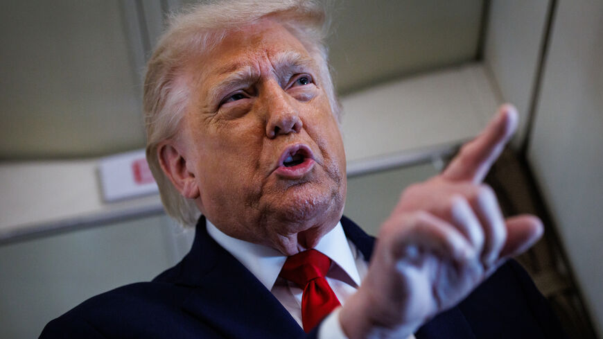 US President Donald Trump speaks with reporters while aboard Air Force One en route to Chippewa Falls, Wisconsin on June 5, 2026. 