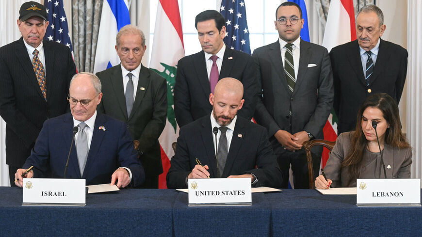 US Secretary of State Marco Rubio (C, back) looks on as (L/R, front row) Israeli Ambassador to the US Yechiel Leiter, State Department Chief of Staff Daniel Holler, and Lebanese Ambassador to the US Nada Hamadeh sign a framework agreement at the US Department of State in Washington, DC, on June 26, 2026. Lebanon, Israel and the United States on Friday signed a trilateral framework agreement aimed at paving the way for a peace deal between the two long-time Middle East adversaries. (Photo by SAUL LOEB / AFP 