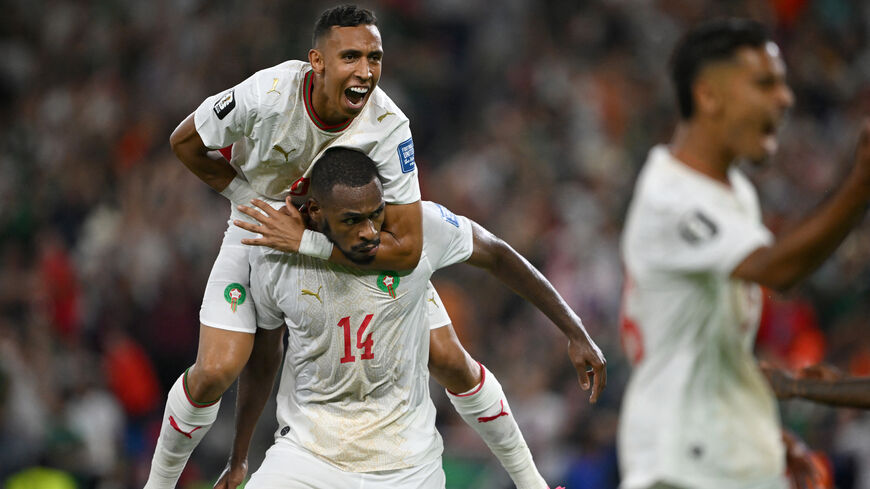 Morocco's defender #14 Issa Diop (R) celebrates scoring his team's first goal during the 2026 World Cup round of 32 football match between the Netherlands and Morocco at the Monterrey Stadium in Guadalupe on June 29, 2026. 