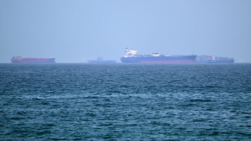 Vessels are pictured off the coast of the Khor Fakkan Container Terminal, a major UAE container port near Oman, in the same region where three tankers were struck