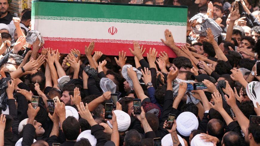 Mourners carry the coffin of Iran's slain supreme leader Ali Khamenei during a funeral procession at the Imam Ali shrine in Iraq's holy city of Najaf