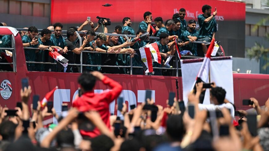 A sea of fans dressed in red, white and black filled the grounds outside the airport in El-Alamein, where the Pharaohs boarded an open-top bus for a parade through the coastal city