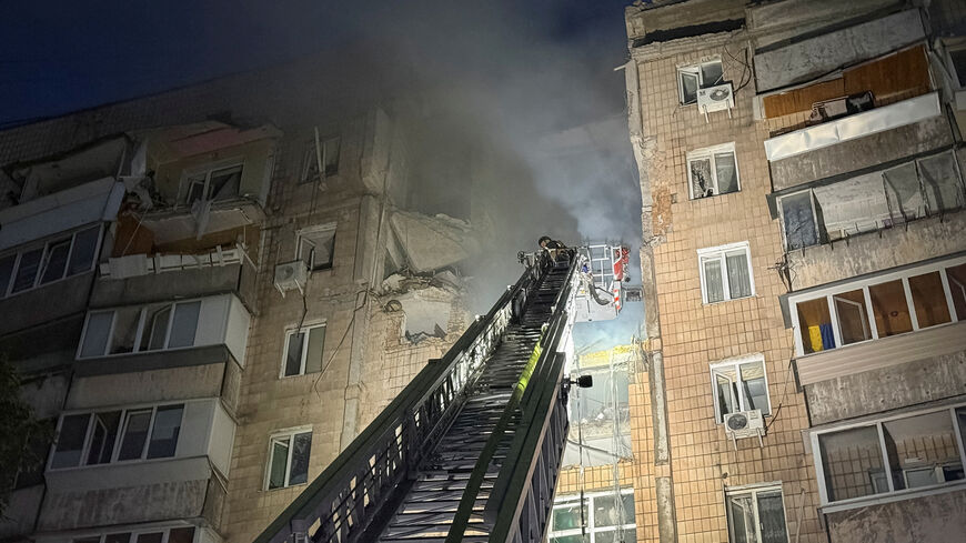 A firefighter works at a site of an apartment building hit during Russian missile and drone strikes, amid Russia’s attack on Ukraine, in Kyiv, Ukraine July 6, 2026. REUTERS/Stringer