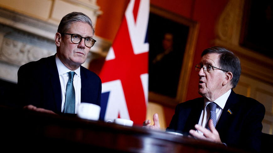 FILE PHOTO: Britain's Prime Minister Keir Starmer (L) listens to Member of the House of Lords George Robertson (R) during a joint meeting with Britain's Defence Secretary John Healey (unseen) at 10 Downing Street, in London, on July 16, 2024.     BENJAMIN CREMEL/Pool via REUTERS/File Photo