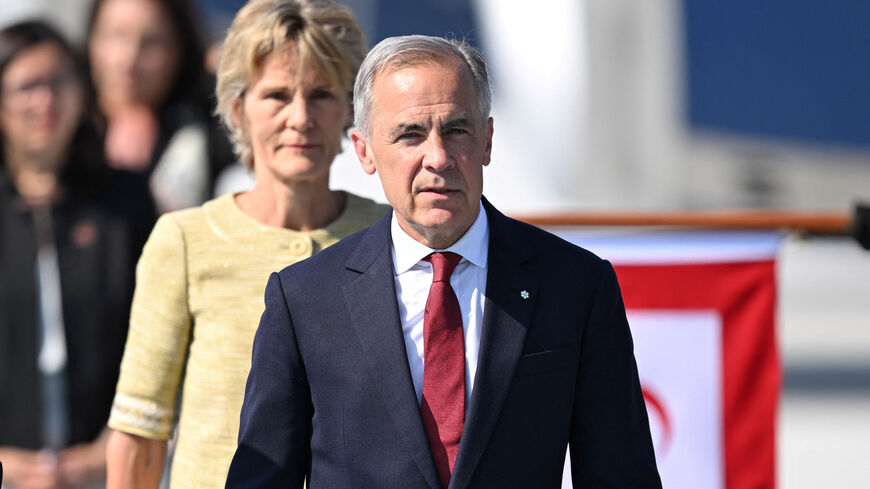 ANKARA, TURKIYE - JULY 07: Canadian Prime Minister Mark Carney and his wife, Diana Fox Carney, arrive at Ankara Airport to attend the 36th NATO Heads of State and Government Summit in Ankara, Turkey, on July 07, 2026.   Muhammed Abdullah Kurtar/Pool via REUTERS