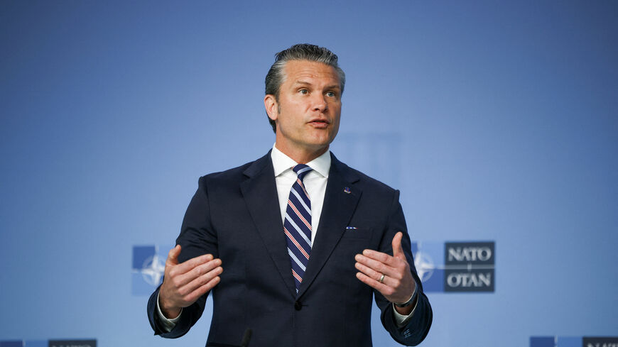 U.S. Defense Secretary Pete Hegseth talks to the media on the day of a meeting of NATO defence ministers at the alliance's headquarters in Brussels, Belgium, June 18, 2026. REUTERS/Stoyan Nenov
