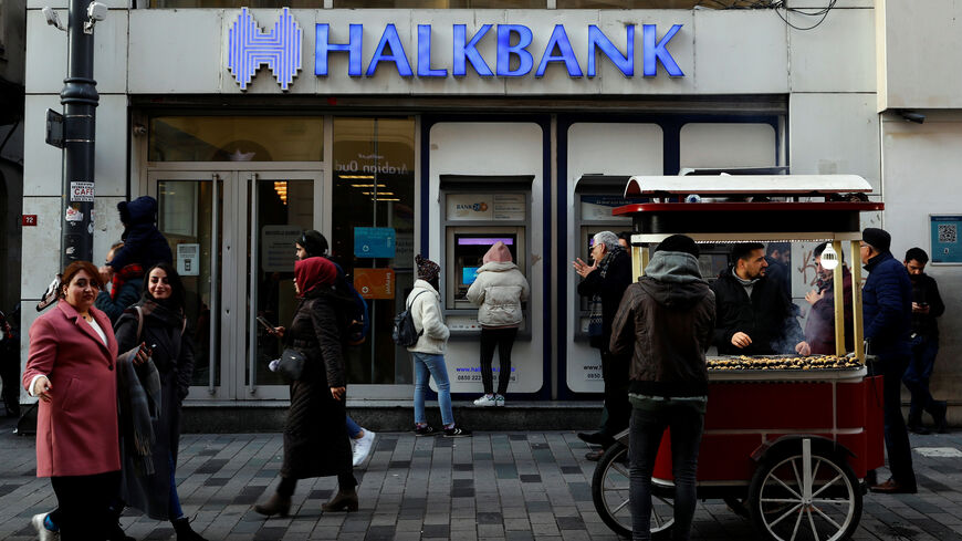 FILE PHOTO: People walk past by a branch of Halkbank in central Istanbul, Turkey, January 22, 2020. REUTERS/Murad Sezer/File Photo