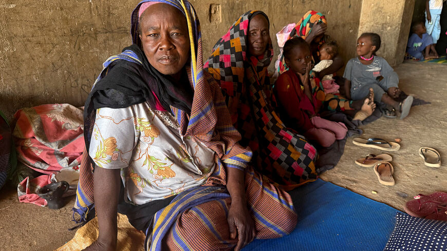 FILE PHOTO: Displaced women from South Kordofan sit on the ground in El Obeid, North Kordofan State, Sudan, January 15, 2026. REUTERS/El Tayeb Siddig/File Photo