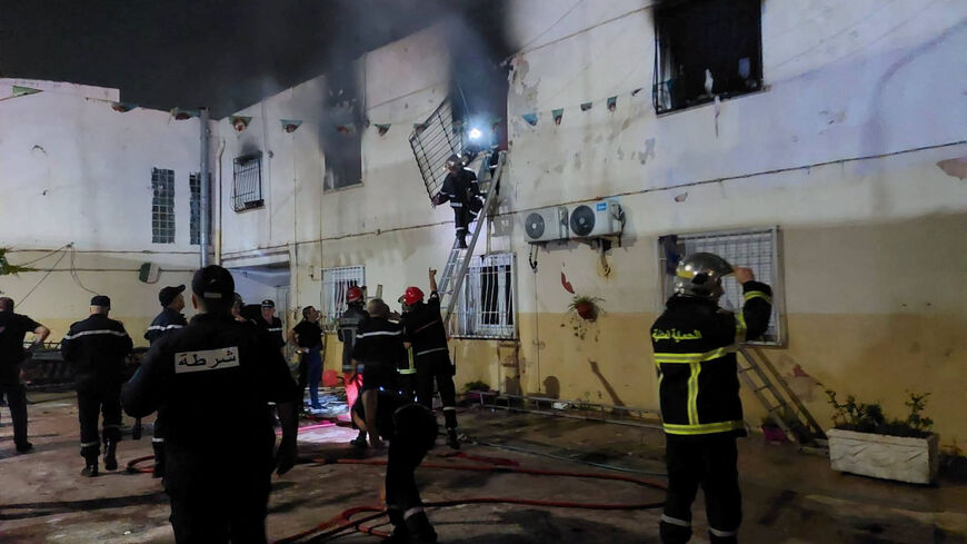 Rescuers and police officers work at the site of a fire at an orphanage near Algiers, Algeria, July 16, 2026. Algerian Civil Protection/Handout via REUTERS