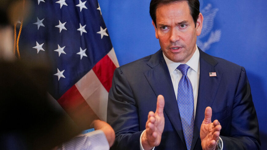 FILE PHOTO: U.S. Secretary of State Marco Rubio speaks with members of the media before departing for Bahrain International Airport after his visit to the Middle East to discuss the interim deal between the U.S. and Iran with Arab Gulf allies, in Manama, Bahrain, June 25, 2026. REUTERS/Eric Lee/Pool/ File Photo