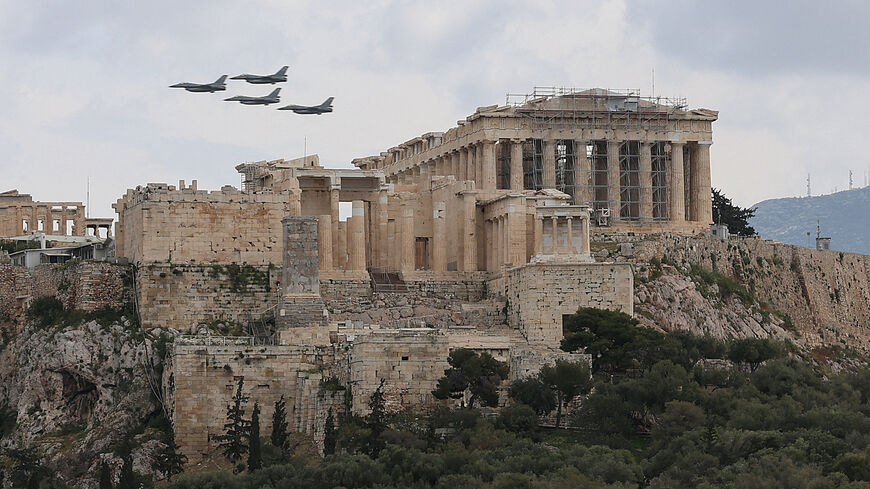 FILE PHOTO: Military planes fly above the Acropolis of Athens, as part of a military parade marking the country’s Independence Day, in Athens, Greece, March 25, 2026. REUTERS/Louisa Gouliamaki/File Photo