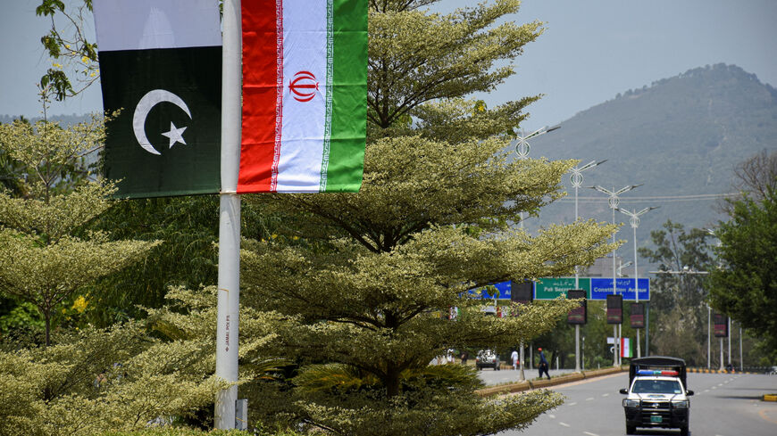 Iranian and Pakistani national flags are displayed along a street ahead of the arrival of Iran's President Masoud Pezeshkian in Islamabad, Pakistan, June 23, 2026. REUTERS/Waseem Khan