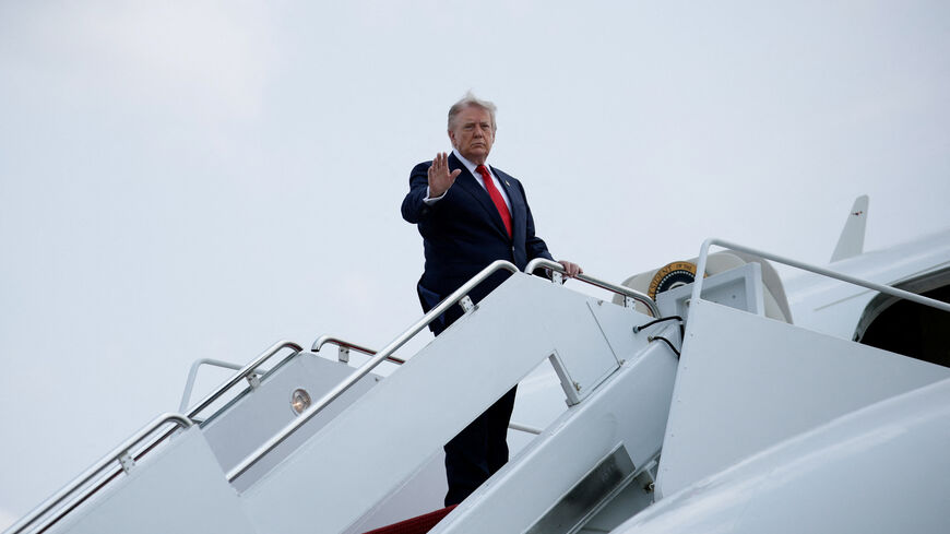 U.S. President Donald Trump gestures as he boards Air Force One en route to Michigan, at Joint Base Andrews, in Maryland, U.S., July 27, 2026. REUTERS/Evan Vucci