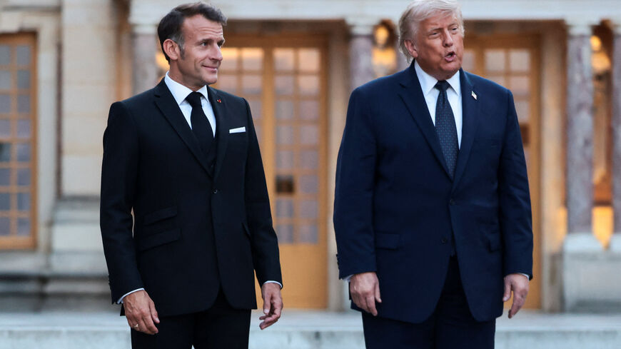 French President Emmanuel Macron welcomes U.S. President Donald Trump for a dinner commemorating the 250th anniversary of the United States' independence, at the Palace of Versailles, near Paris, France, June 17, 2026. REUTERS/Evelyn Hockstein/File Photo