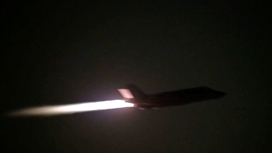 FILE PHOTO: A U.S. military aircraft flies at an unknown location, during what U.S. Central Command (CENTCOM) says are strikes on Iran, in this screengrab taken from a handout video released on July 20, 2026. U.S. Central Command/Handout via REUTERS/File Photo