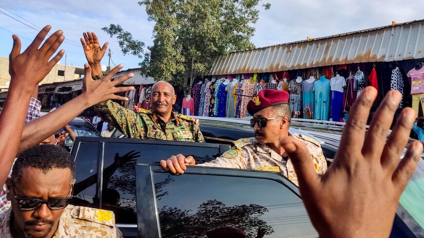 Sudan's de facto leader and armed forces chief Abdel Fattah al-Burhan greets supporters in Port Sudan, Dec. 29, 2024.