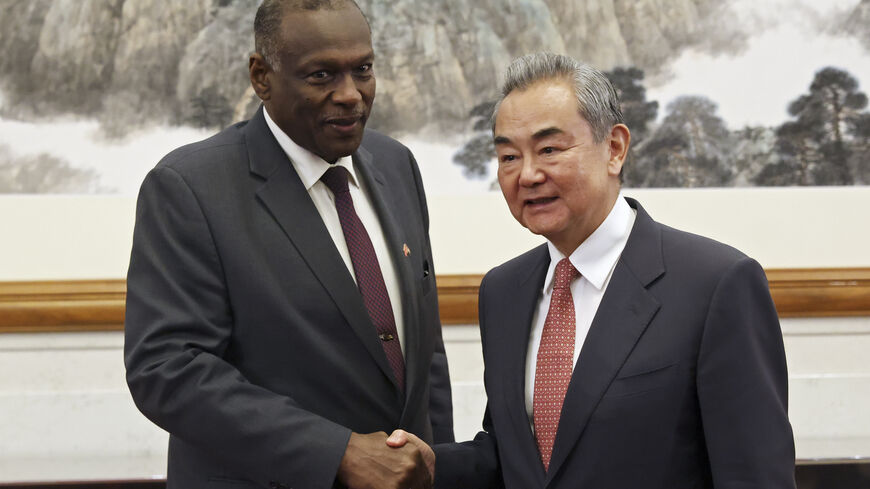 BEIJING, CHINA - MAY 14: Chinese Foreign Minister Wang Yi (R) shake hands with Omar Seddik, Sudan's newly appointed foreign minister before their meeting during the China-CELAC Forum at Diaoyutai State Guest House on May 14, 2025 in Beijing, China. The summit includes China's key Latin American trade partners, and comes as Beijing and Washington work on defusing a trade war. (Photo by Florence Lo - Pool/Getty Images)