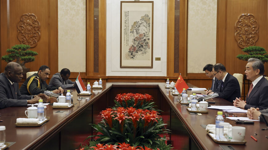 Chinese Foreign Minister Wang Yi (R) and Omar Siddig, Sudan's then-foreign minister, (L) attend a meeting during the China-CELAC Forum at Diaoyutai State Guest House on May 14, 2025 in Beijing, China.