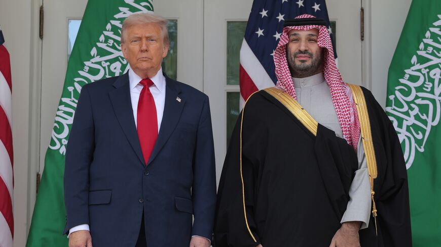 President Donald Trump (L) and Crown Prince and Prime Minister Mohammed bin Salman of Saudi Arabia pause for photographs along the West Wing Colonnade at the White House on Nov. 18, 2025, in Washington.