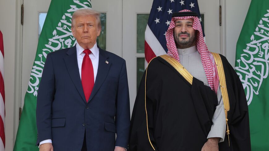 US President Donald Trump (L) and Crown Prince and Prime Minister Mohammed bin Salman of Saudi Arabia pause for photographs along the West Wing Colonnade at the White House on Nov. 18, 2025, in Washington.