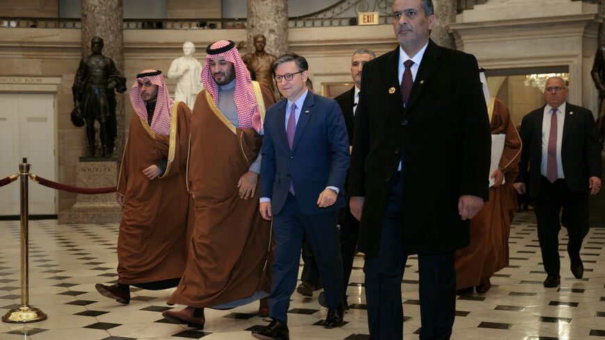 Crown Prince and Prime Minister Mohammed bin Salman of Saudi Arabia (2nd L) is escorted by Speaker of the House Mike Johnson (R-LA) through Statuary Hall as they head to a meeting at the U.S. Capitol on Nov. 19, 2025 in Washington, DC. 