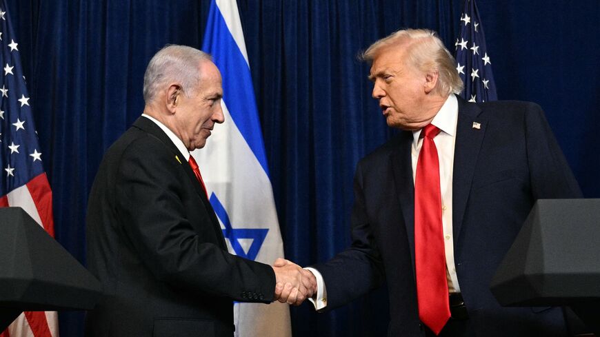 US President Donald Trump (R) and Israeli Prime Minister Benjamin Netanyahu shake hands as they arrive to speak to journalists during a joint press conference at Trump's Mar-a-Lago residence in Palm Beach, Florida, on Dec. 29, 2025. 