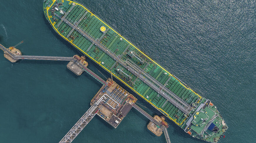 This aerial photo shows a tanker unloading imported crude oil at a terminal port in Qingdao, in China's eastern Shandong province on June 25, 2026. (Photo by CN-STR / AFP via Getty Images) / China OUT