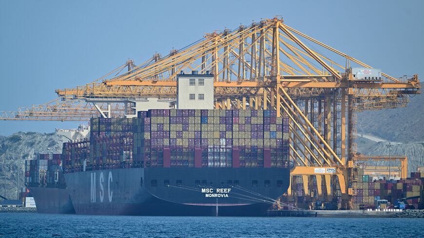 The Liberian-flagged container vessel MSC Reef is seen docked along a pier at the Khor Fakkan Container Terminal, the only natural deep-sea port in the region and one of the major container ports in Sharjah Emirate, along the Gulf of Oman, on June 28, 2026.