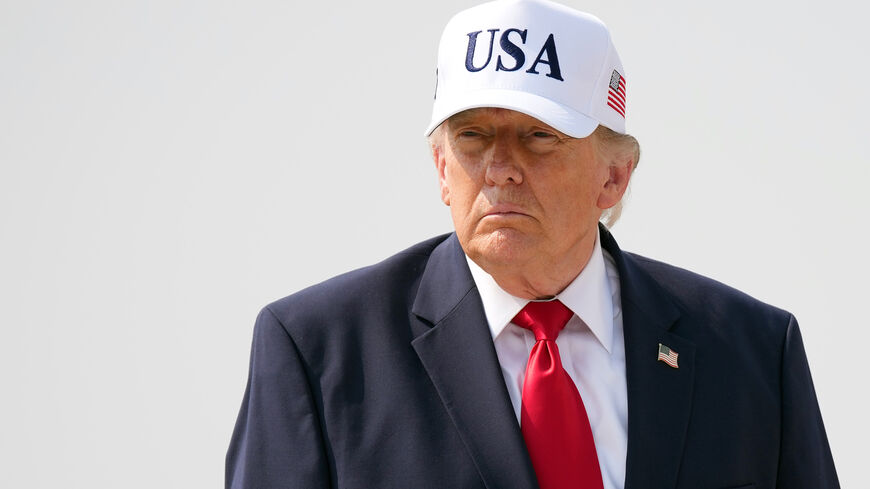 US President Donald Trump walks to board Air Force One as he departs Bismarck Municipal Airport on July 01, 2026 in Bismarck, North Dakota. 