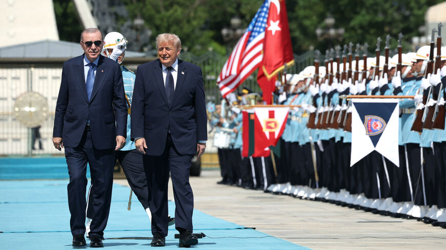 US President Donald Trump walks with Turkish President Recep Tayyip Erdogan during a state arrival ceremony at the Bestepe Presidential Complex for the annual NATO Summit on July 7, 2026 in Ankara, Turkey.