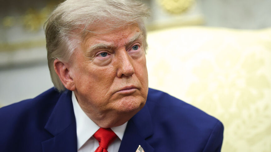US President Donald Trump listens to a reporter's question as he holds a bilateral meeting with President of Lebanon Joseph Aoun in the Oval Office of the White House on July 21, 2026 in Washington, DC. 