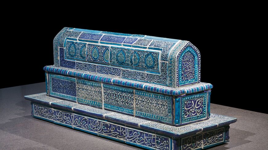 A blue and turquoise glazed ceramic cenotaph decorated with Arabic calligraphy and floral motifs, on display during the exhibition "Uzbekistan: Heritage in Motion" at the Museum of Islamic Art in Doha. (Photo courtesy of MIA)