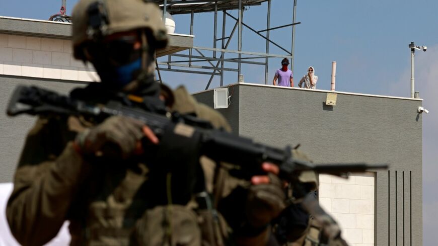 Israeli settlers began their siege of Palestinian homes on Sunday
