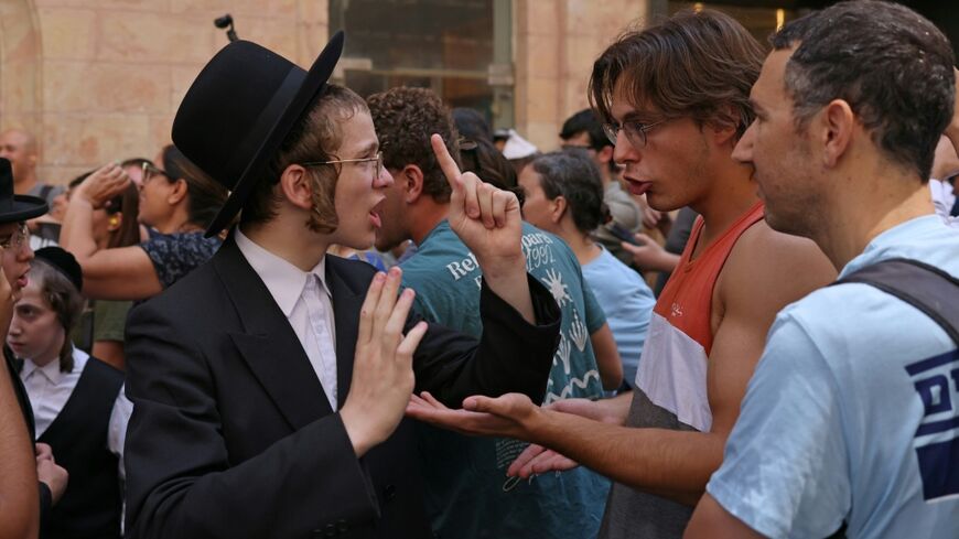 Ultra-Orthodox protesters demonstrate against Cafe Basimta operating on Shabbat, the weekly Jewish day of rest, as secular activists stage a counter-protest in support of the cafe, in central Jerusalem
