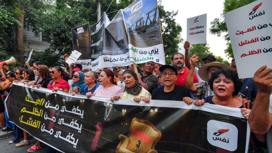 Demonstrators march in Tunis to protest against President Kais Saied, as well as water and electricty shortages